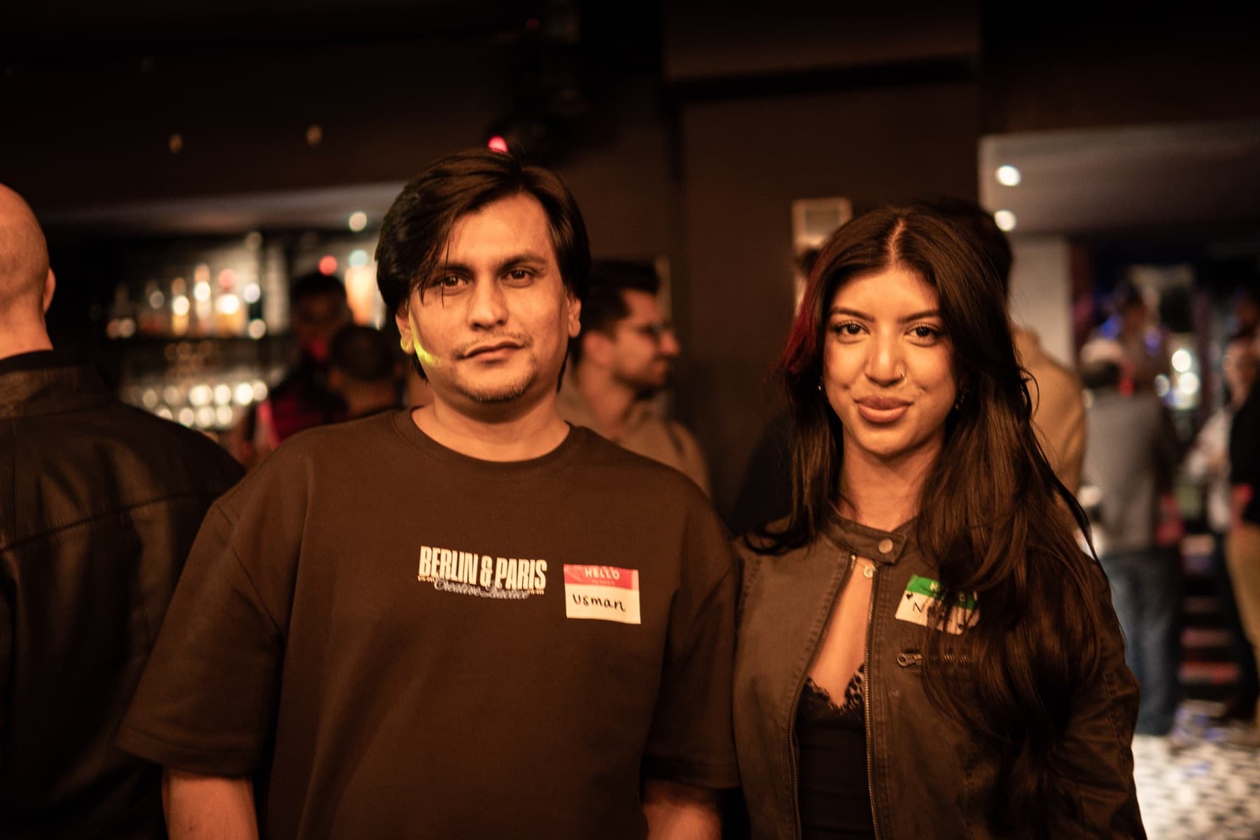 Usman and Naz, wearing name badges, in a bar at the Silicon Mingle launch in Leeds.