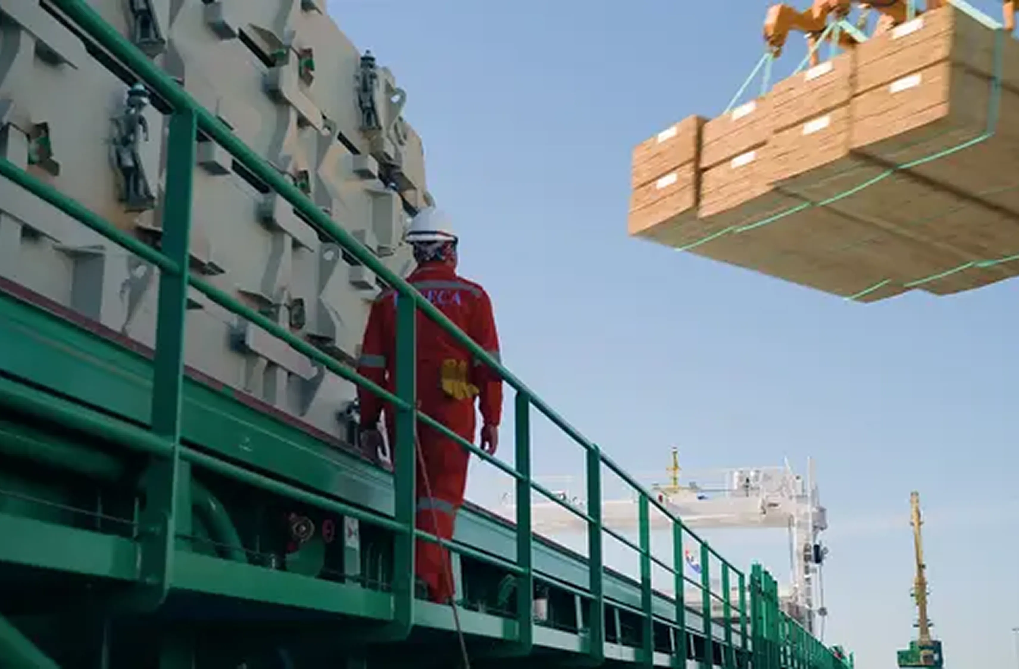 Timber packs being loaded aboard