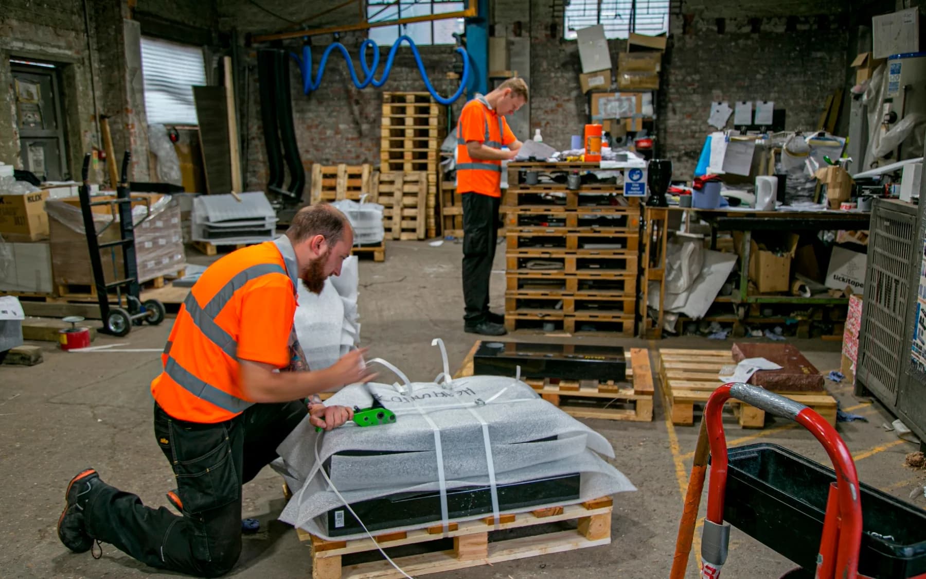 Memorials being wrapped and palleted in the workshop